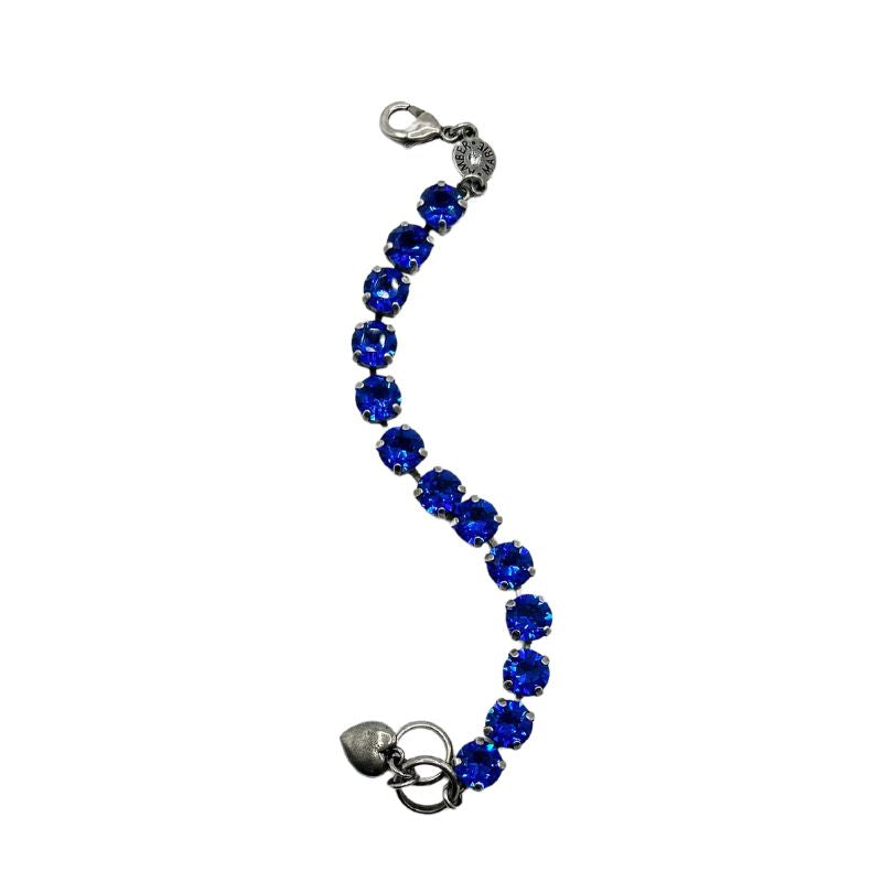 Classic Santorini bracelet featuring blue ombre stones, amber tag, crystal accent, and Scotty dog heart charm.