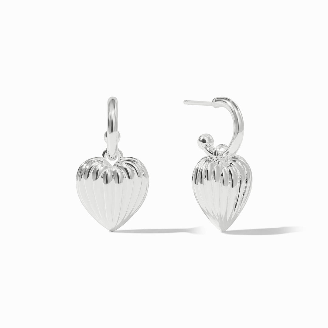 Silver puffy heart hoop and charm earrings with a ribbed texture on the heart charms.