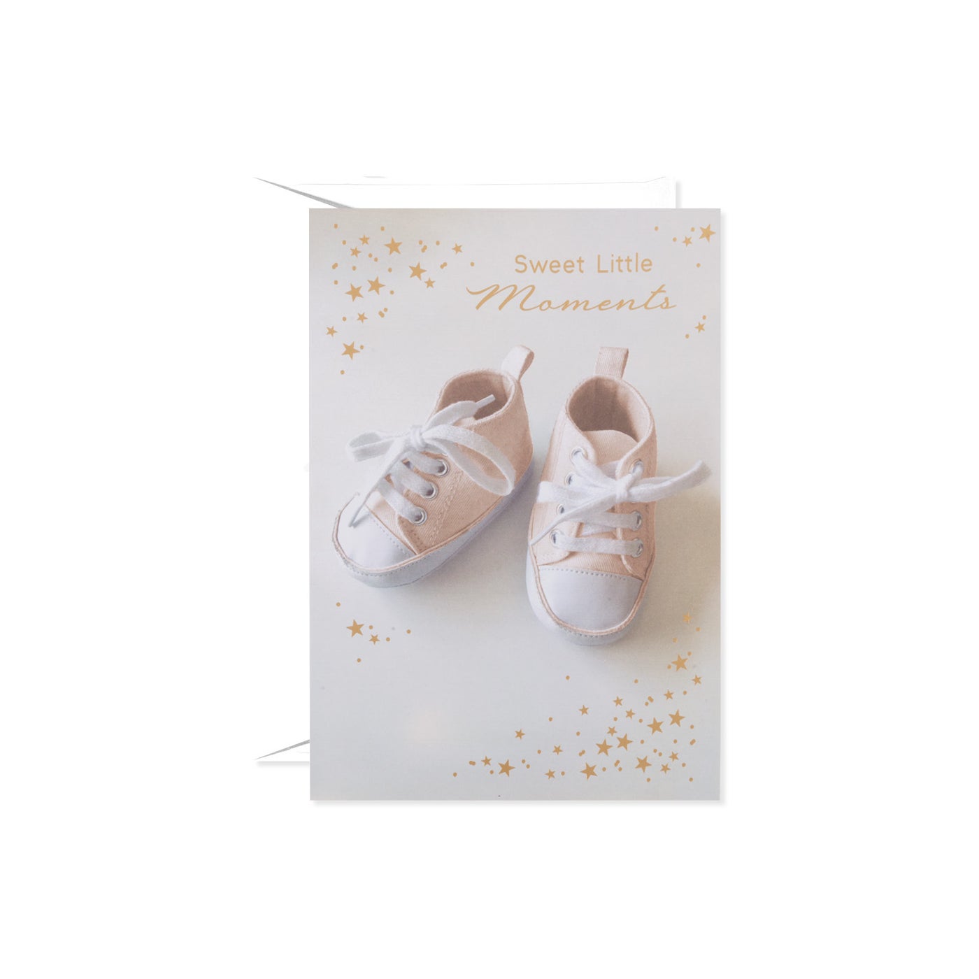 Card featuring a pair of light pink baby sneakers with white laces and a white sole, surrounded by gold stars.
