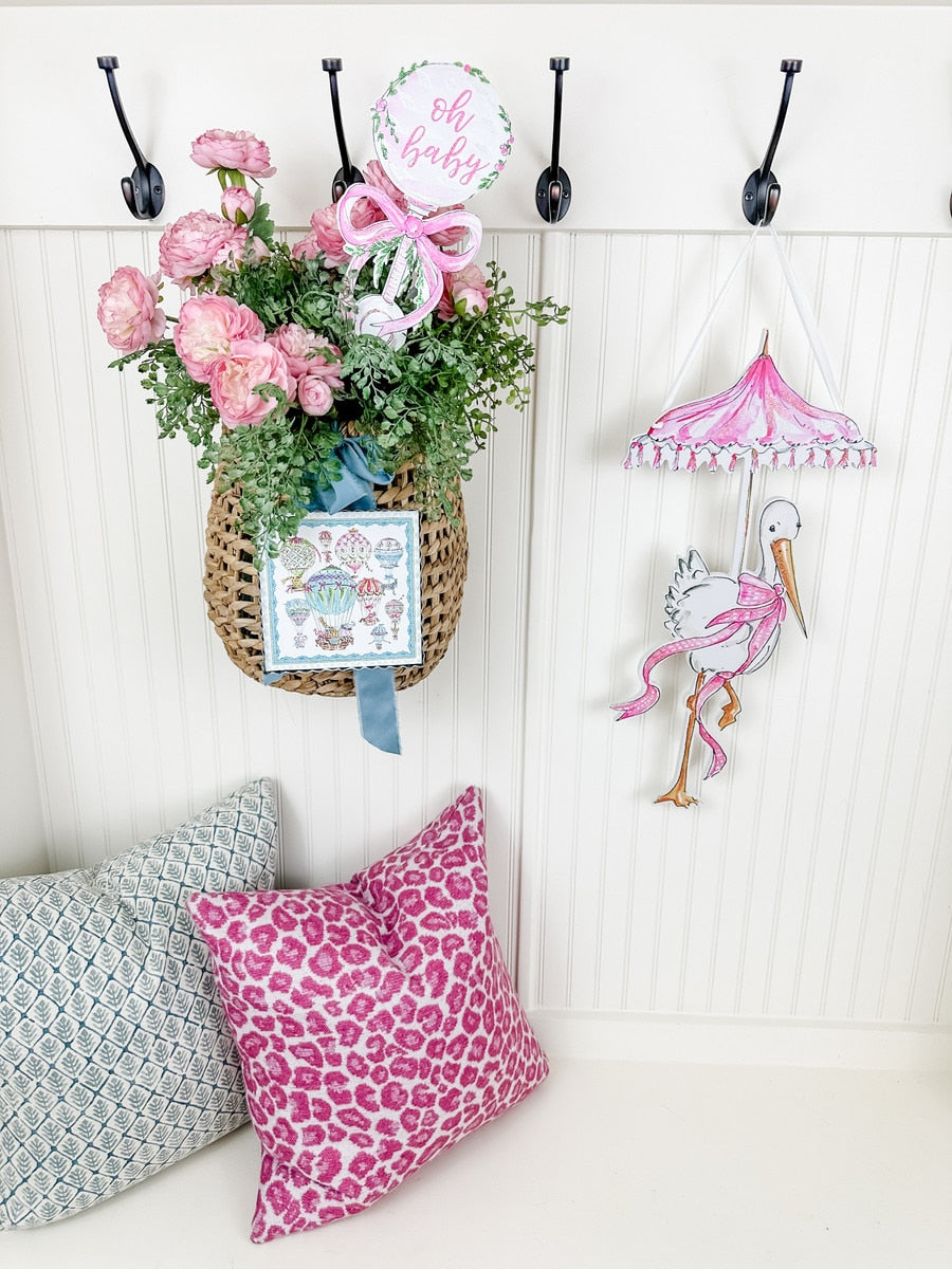 Beck's Stork door hanger in natural wood finish with a carved stork silhouette and hanging loop.