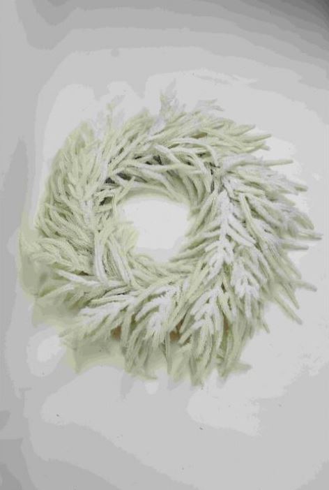 28-inch white real touch snow Norfolk pine wreath with frosted needles.