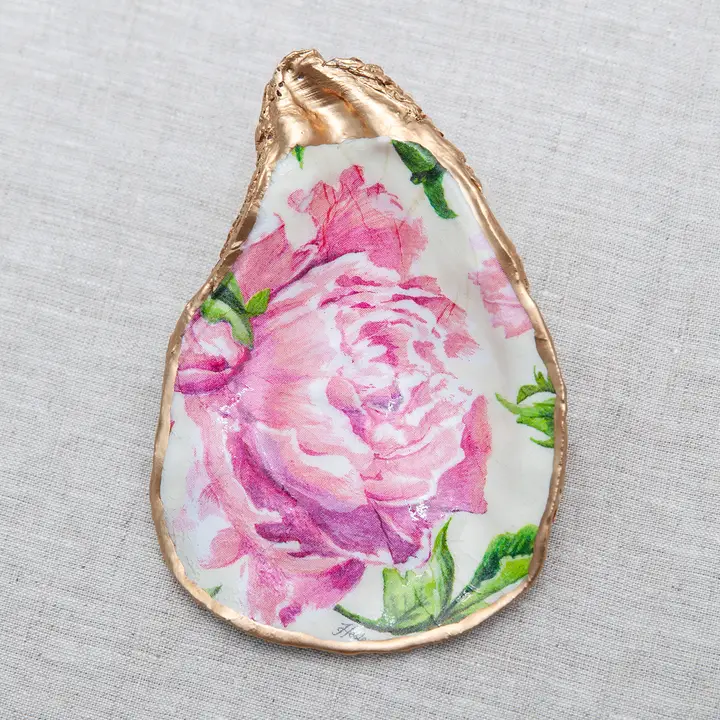 Decoupaged oyster shell with pink peony floral design and metallic gold trim.