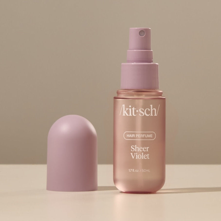 Sheer violet hair perfume bottle with floral fruity musk scent in a travel-friendly size.