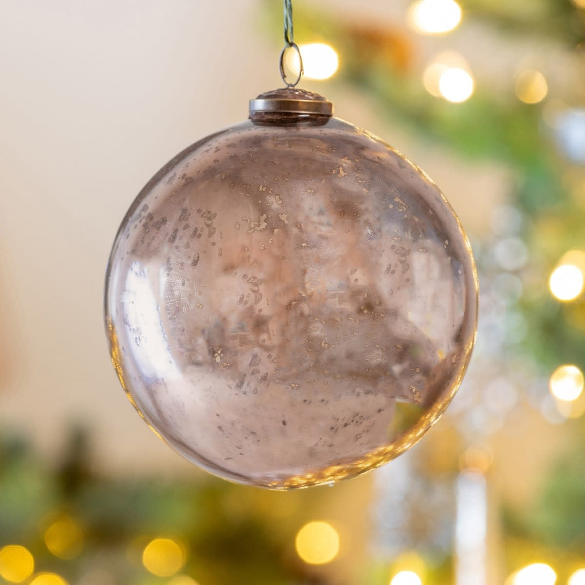 Shiny light gold glass ball ornament with vintage holiday sparkle