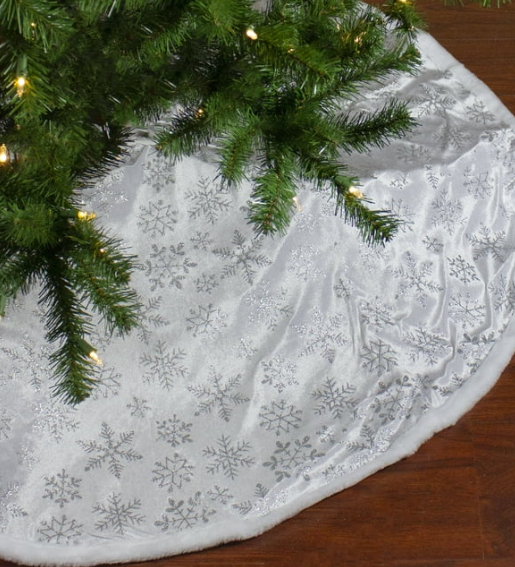 48-inch white felt Christmas tree skirt with faux fur border and shimmering silver snowflake pattern.
