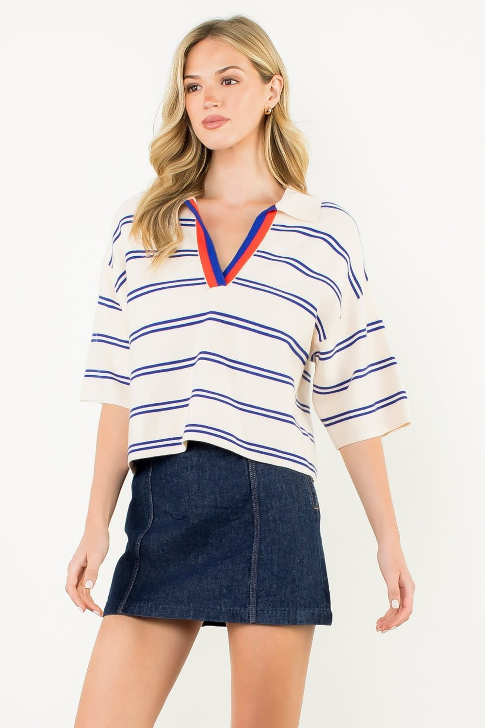 Blue short-sleeve striped knit top with a relaxed fit.