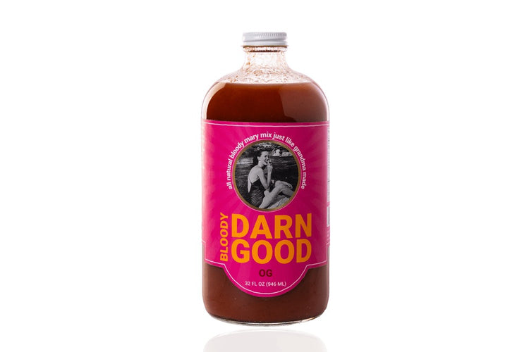 32 oz bottle of OG Bloody Darn Good Bloody Mary Mix with a pink label and white cap.