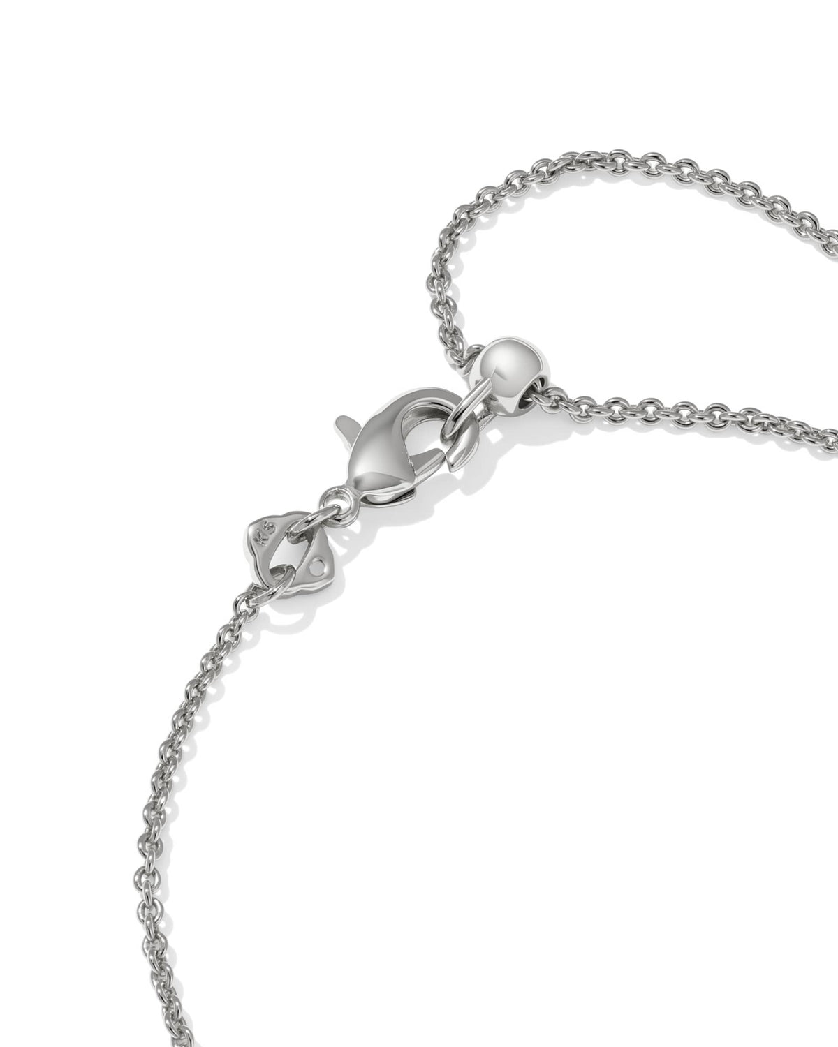 Delicate rhodium chain bracelet with white cubic zirconia cross pendant