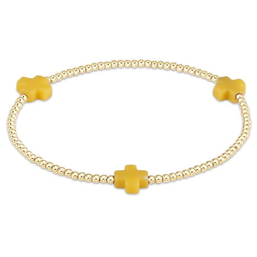 Gold-filled Signature Cross bead bracelet with a cross pattern on high-performance elastic.