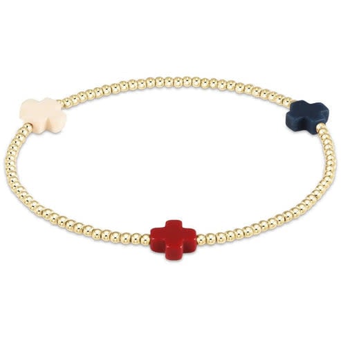 Gold-filled elastic bracelet with signature cross beads in a gold bead pattern.