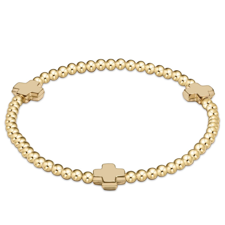 Gold-filled bracelet with signature cross beads on elastic cord