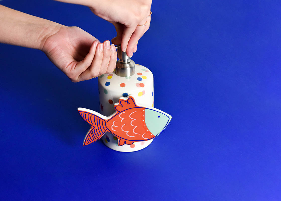 Ceramic Bubbles the Fish mini attachment with hook-and-loop fastener in neutral tone.