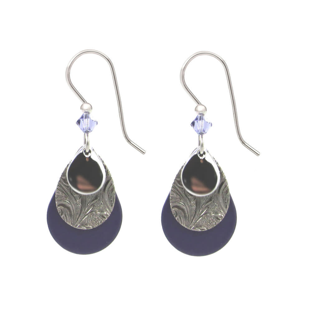 Silver filigree teardrop earrings with purple bead accents on black background