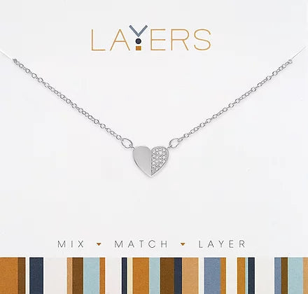 Silver layered necklace featuring half-cut cubic zirconia heart pendants