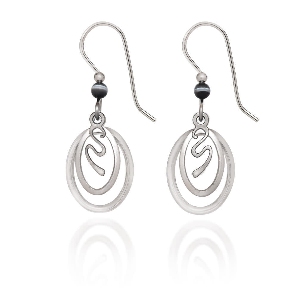 Silver surgical steel earrings featuring squiggle patterns inside oval frames with Austrian crystals.