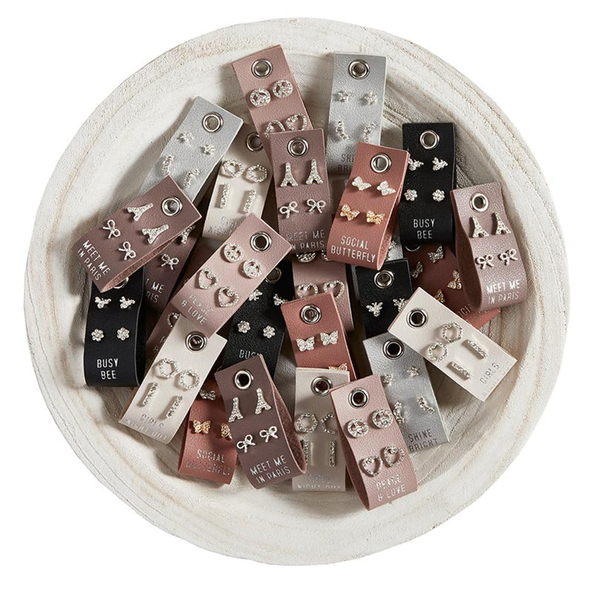 Silver stud earrings featuring a leather tag with rhinestone accents.