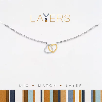 Silver two-tone layered necklace featuring double heart pendants on a delicate chain.