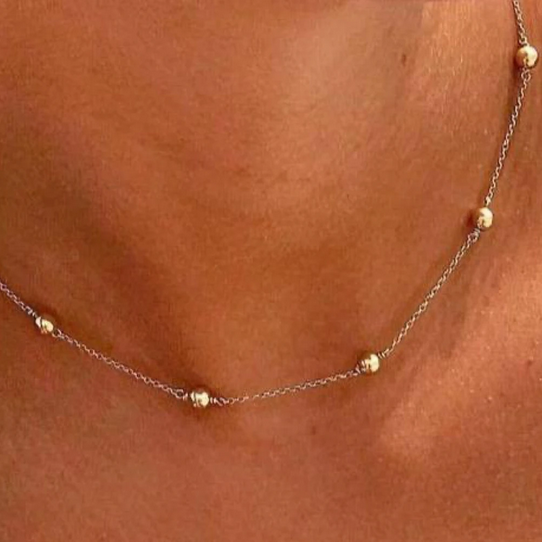 Gold choker necklace featuring a 4mm gold-filled bead on a 14kt gold-filled chain.