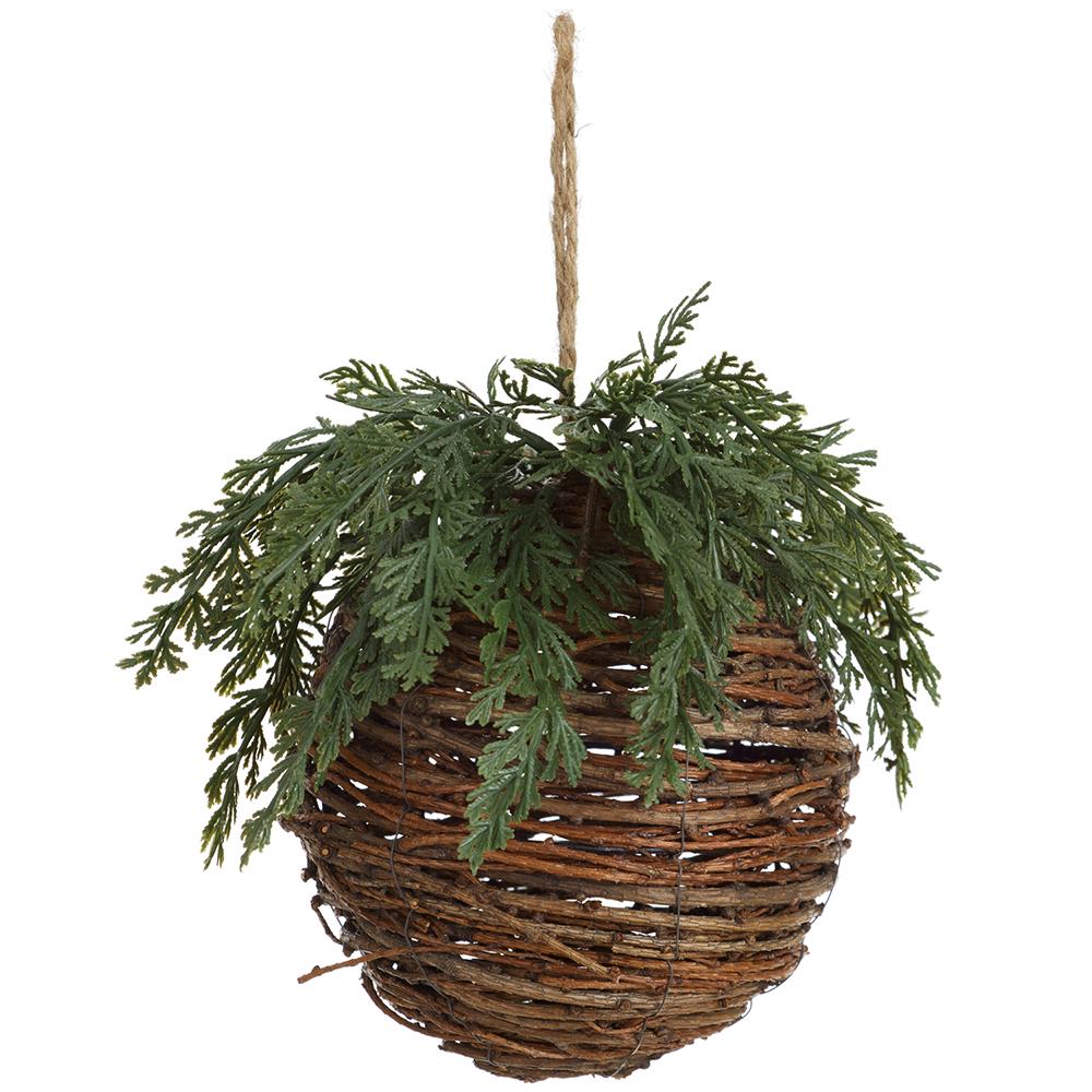 Woven brown twig ball ornament with green faux cedar foliage and a jute hanging string.