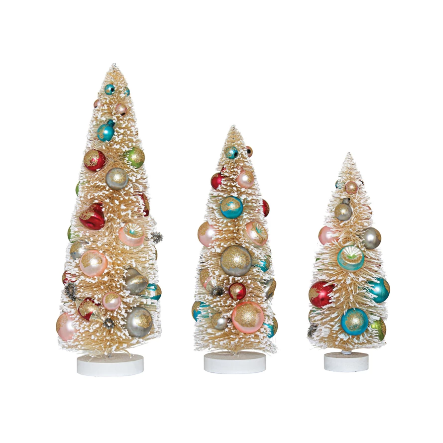 Sisal bottle brush tree with antique white flocking, multi-color ornaments on a wood base.