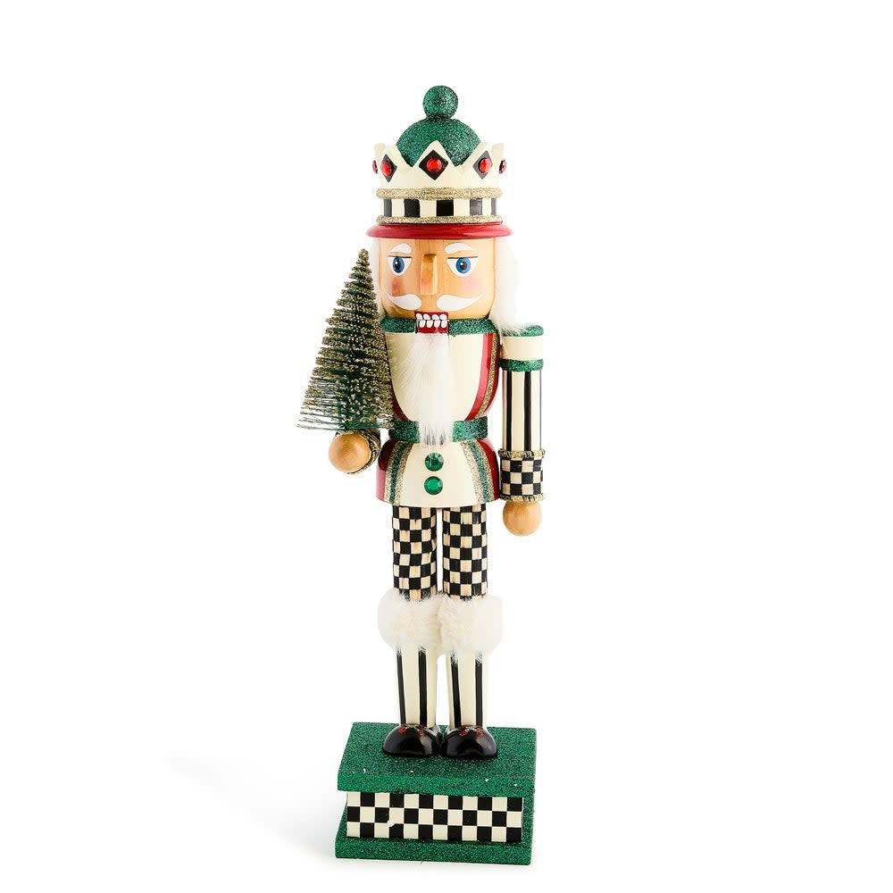 Wooden nutcracker shaped like a sisal tree with green fabric leaves.