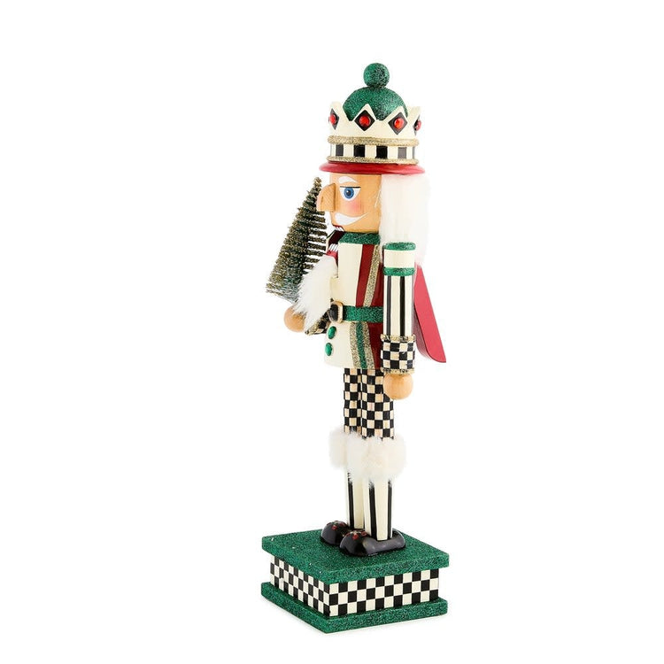 Handmade wooden nutcracker shaped like a sisal tree with green fabric leaves and brown trunk details.
