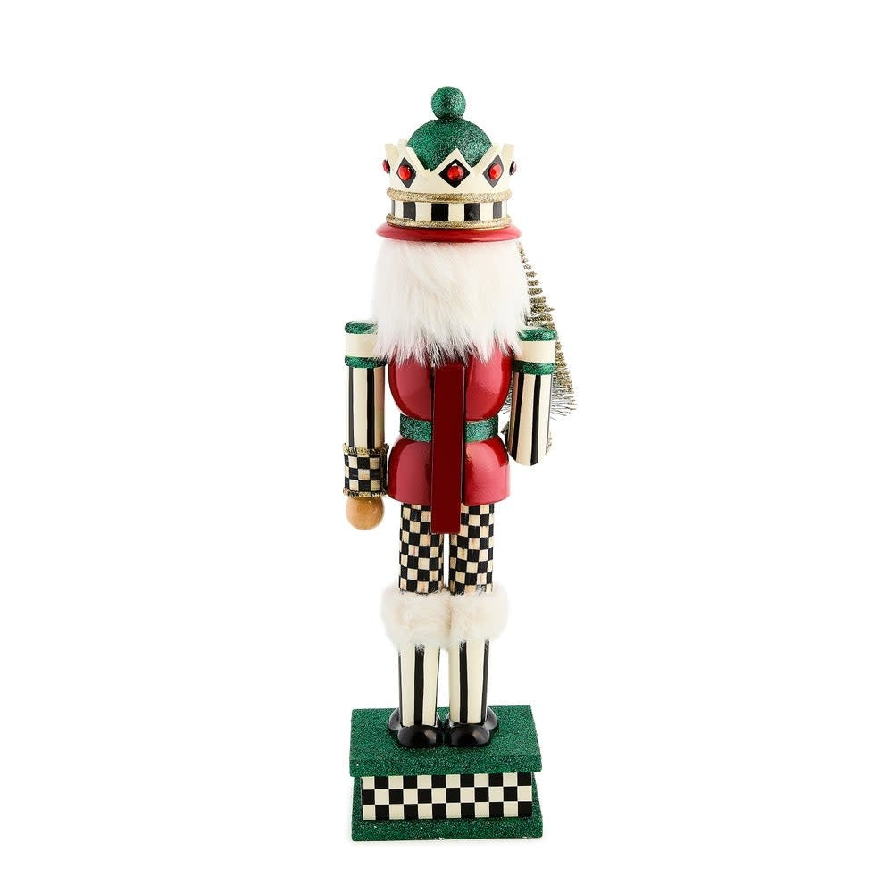 Wooden sisal tree nutcracker with polyester fabric leaves standing on a base.