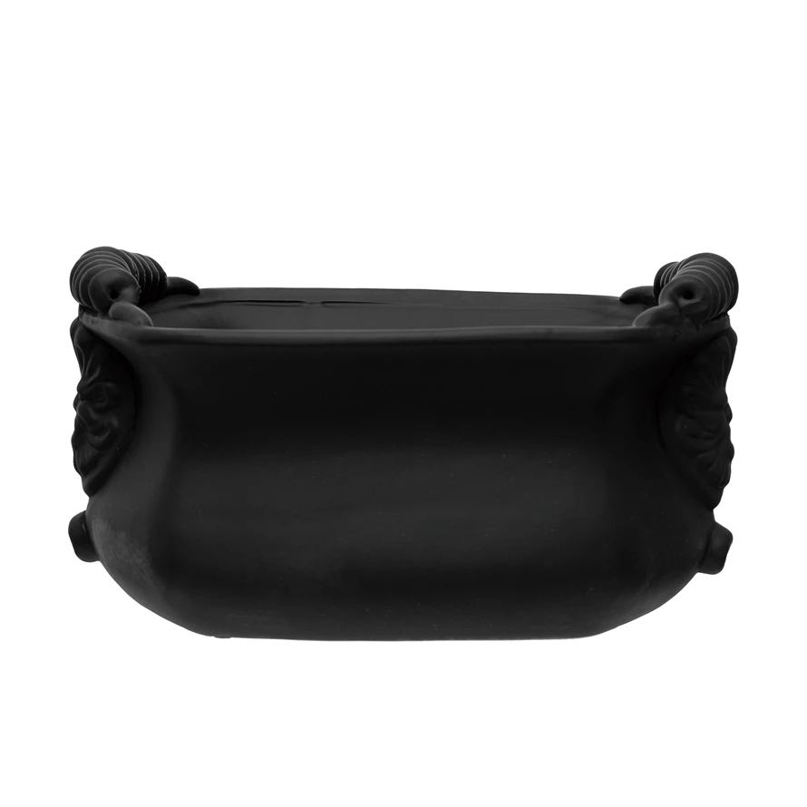 Terra-cotta cachepot with a rounded terracotta body.