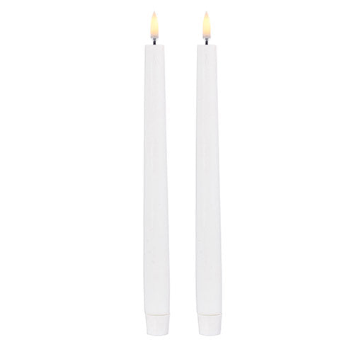 Set of two white tapered candles with a smooth wax finish.