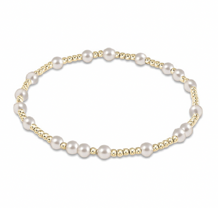 Hope Unwritten bracelet featuring hand-beaded 4mm pearls alternating with 2mm gold-filled beads on stretch elastic cord.