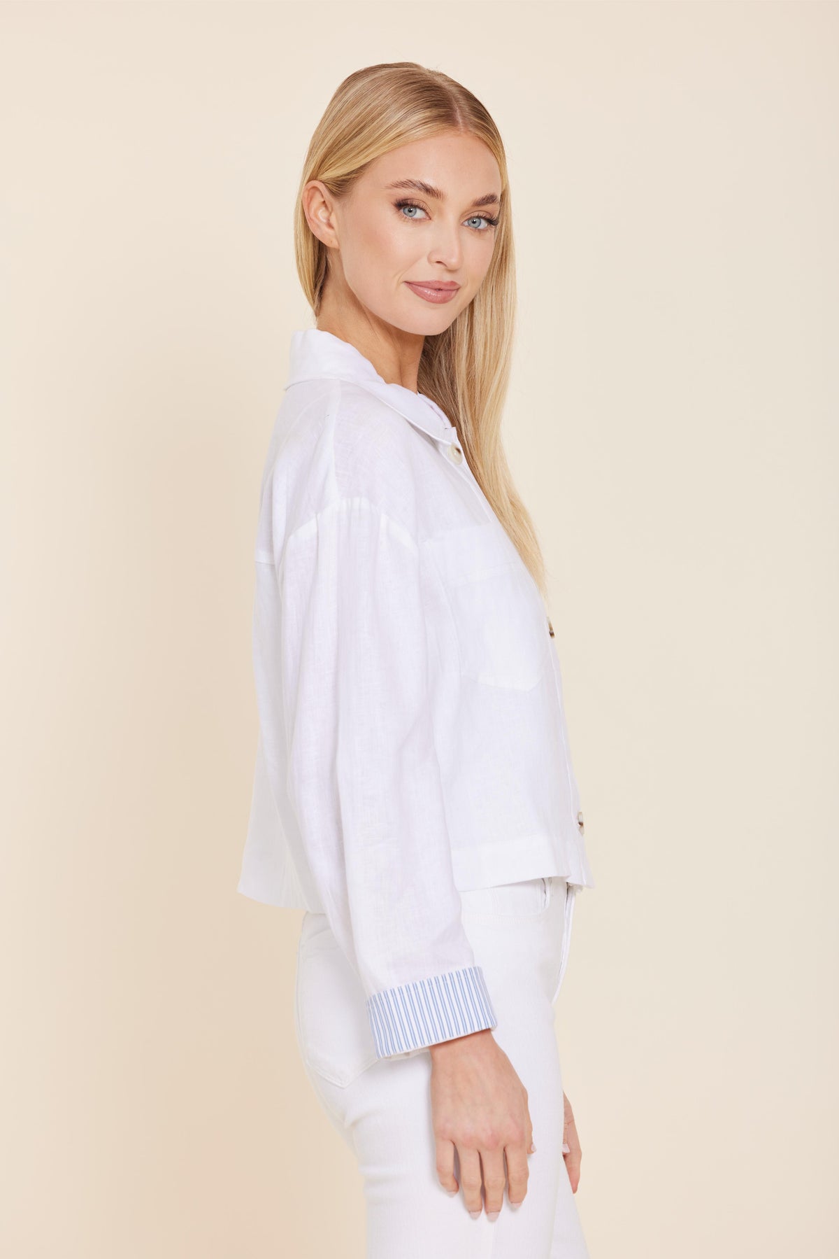 Relaxed fit Grace linen jacket with button-up front and pin stripe cuffs in natural color.
