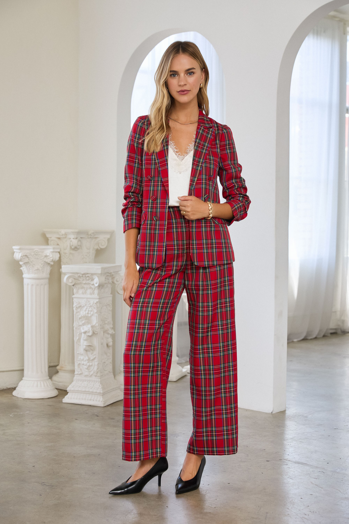 Woman wearing a red Hera Tartan Check Double-Breasted Blazer with matching wide-leg trousers.