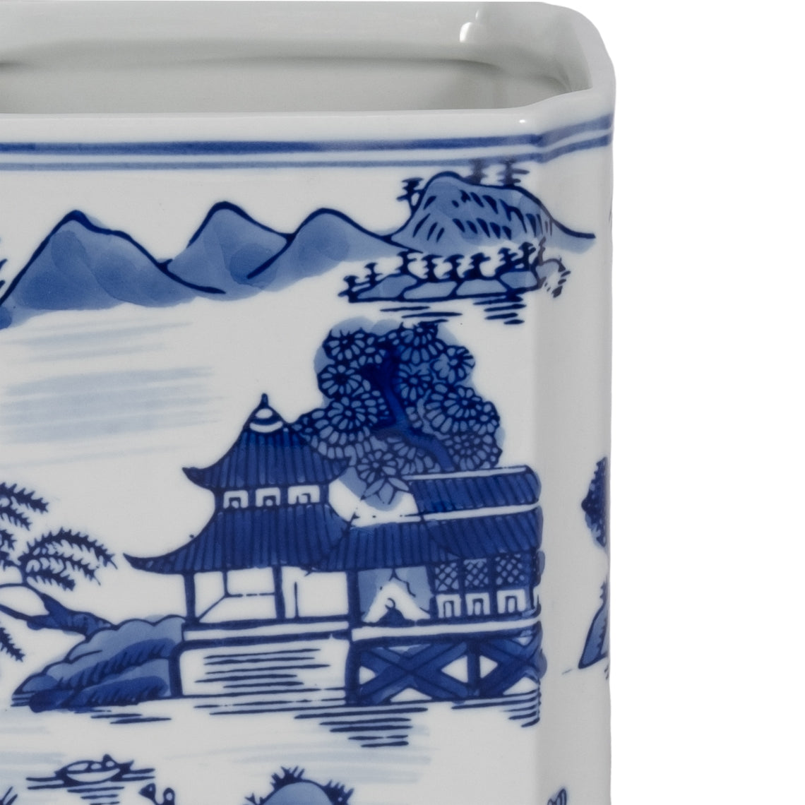 Close-up of blue and white ceramic jar featuring a traditional Chinese landscape scene.