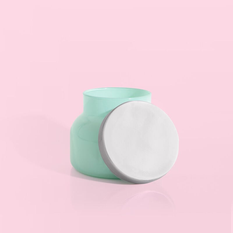 Volcano Aqua Petite Signature Jar, 8 oz, mint green glass candle jar with silver lid on pink background