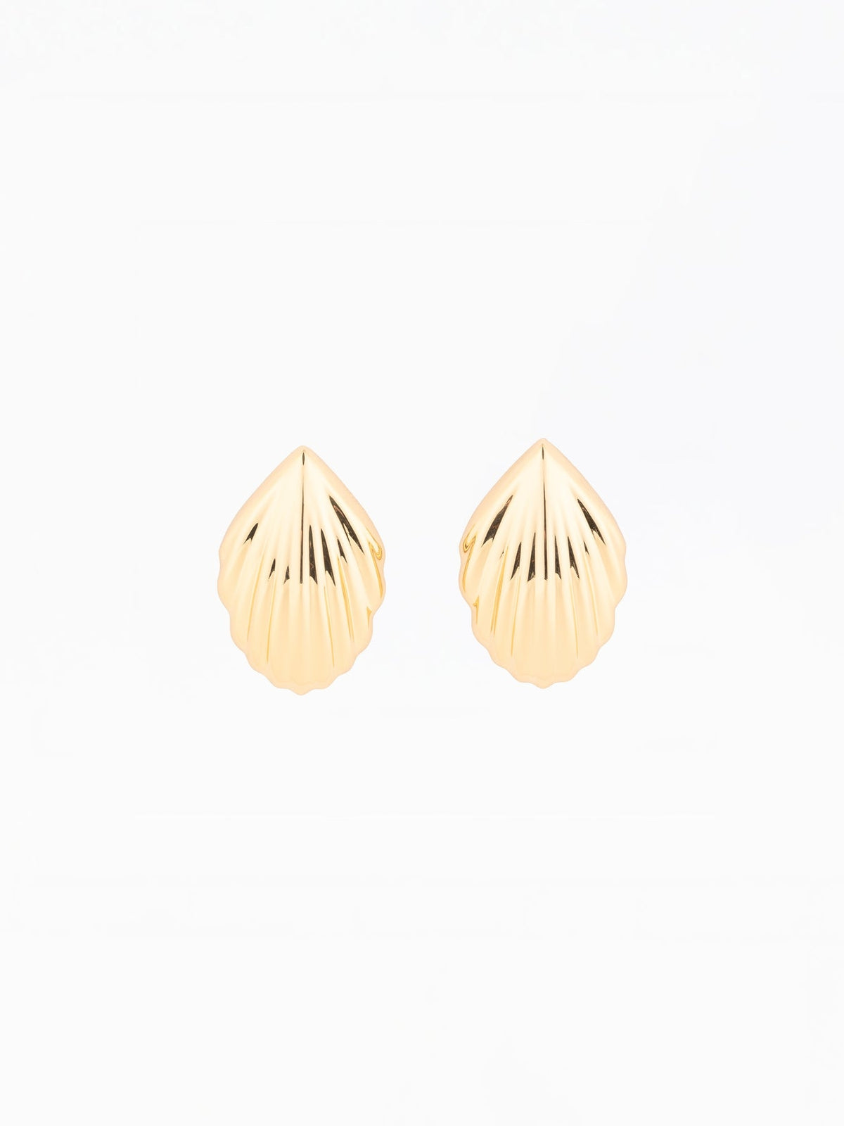 Pair of gold-plated Skyla shell-shaped stud earrings with a ribbed texture on a white background.
