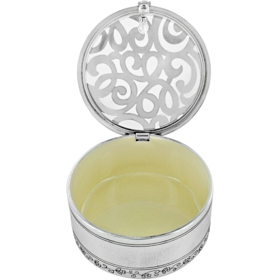 Silver hammered round trinket box with a scribble art scrolled pattern top.