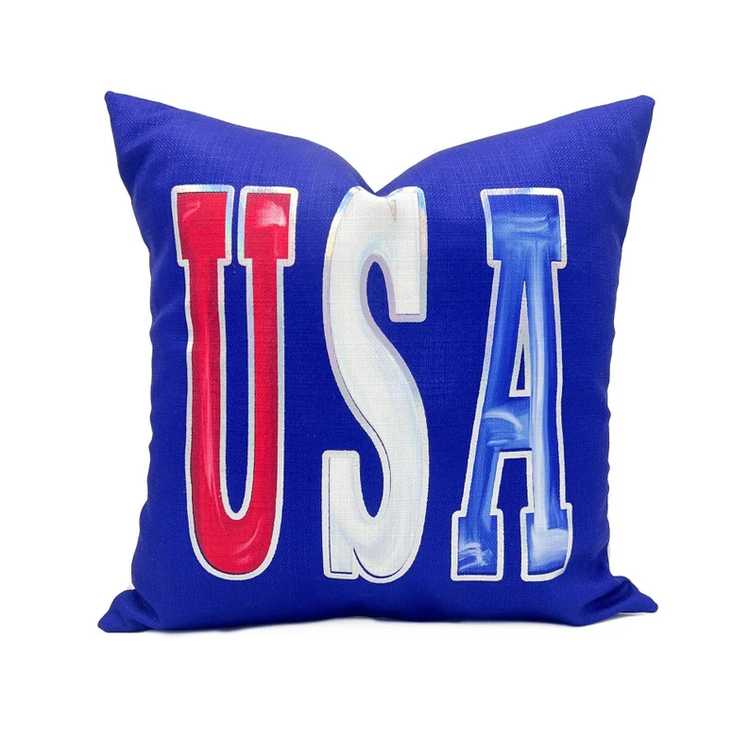 Handmade USA Pillow with a sky blue fabric cover featuring white cloud patterns.