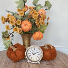 Artificial orange pumpkin vine with realistic leaves on a flexible stem.