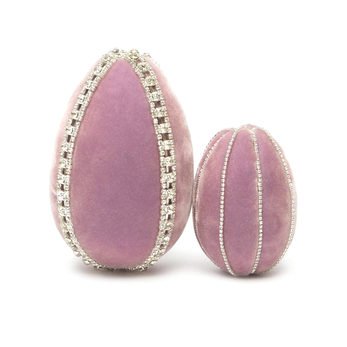 Two decorative silk velvet eggs in lavender, one large and one small, adorned with sparkling rhinestone trim.
