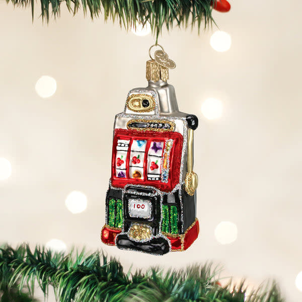 Glass slot machine ornament with silver accents and hand-painted glitter finish