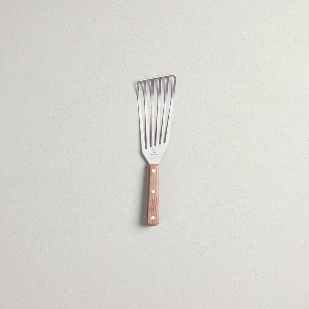 Slotted spatula with full tang walnut handle and stainless steel blade