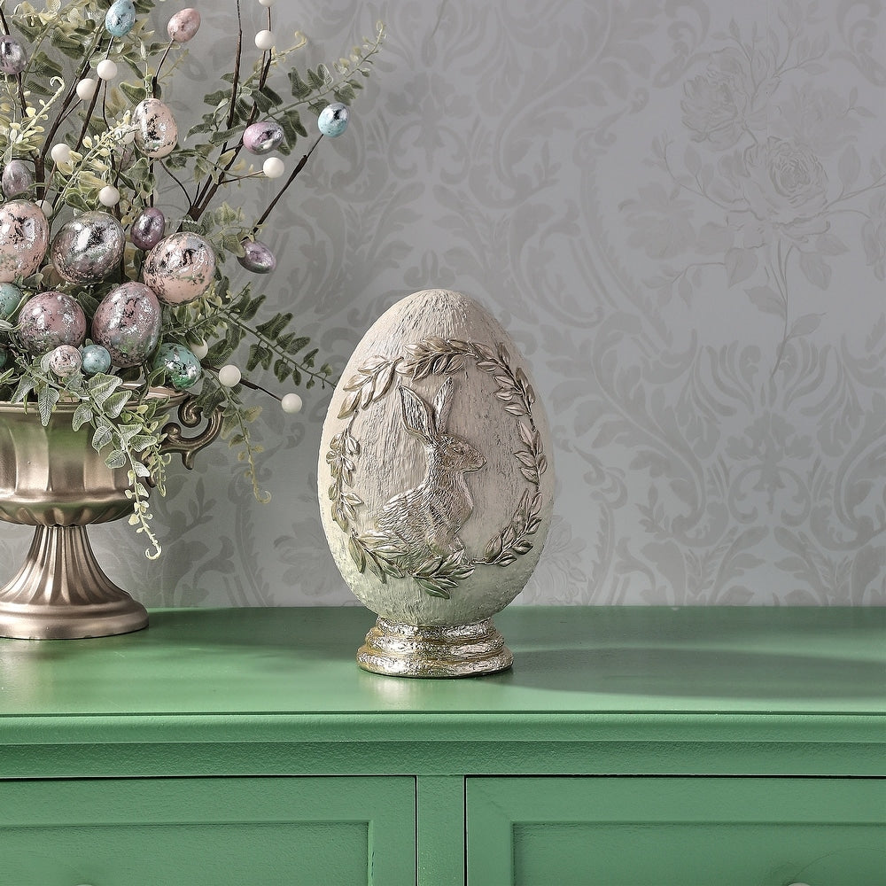 8.5-inch resin Easter egg in royal blue with a white bunny silhouette on top.