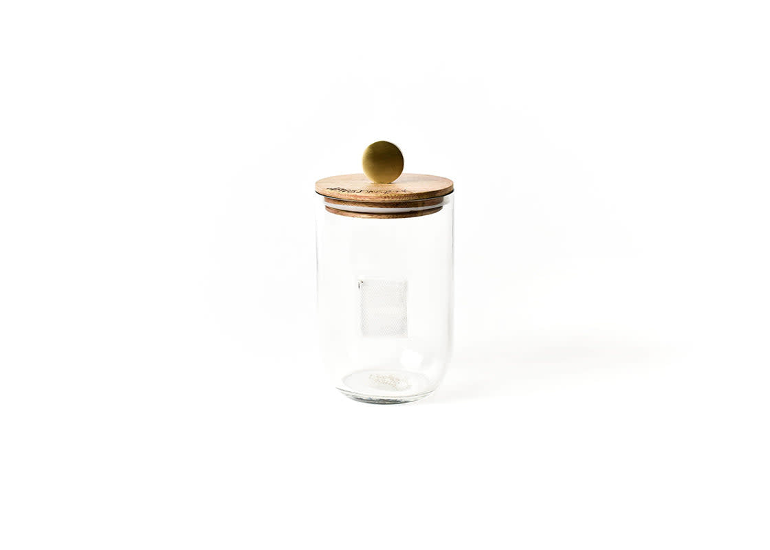 Small glass storage jar with a mango wood lid featuring a metal knob.