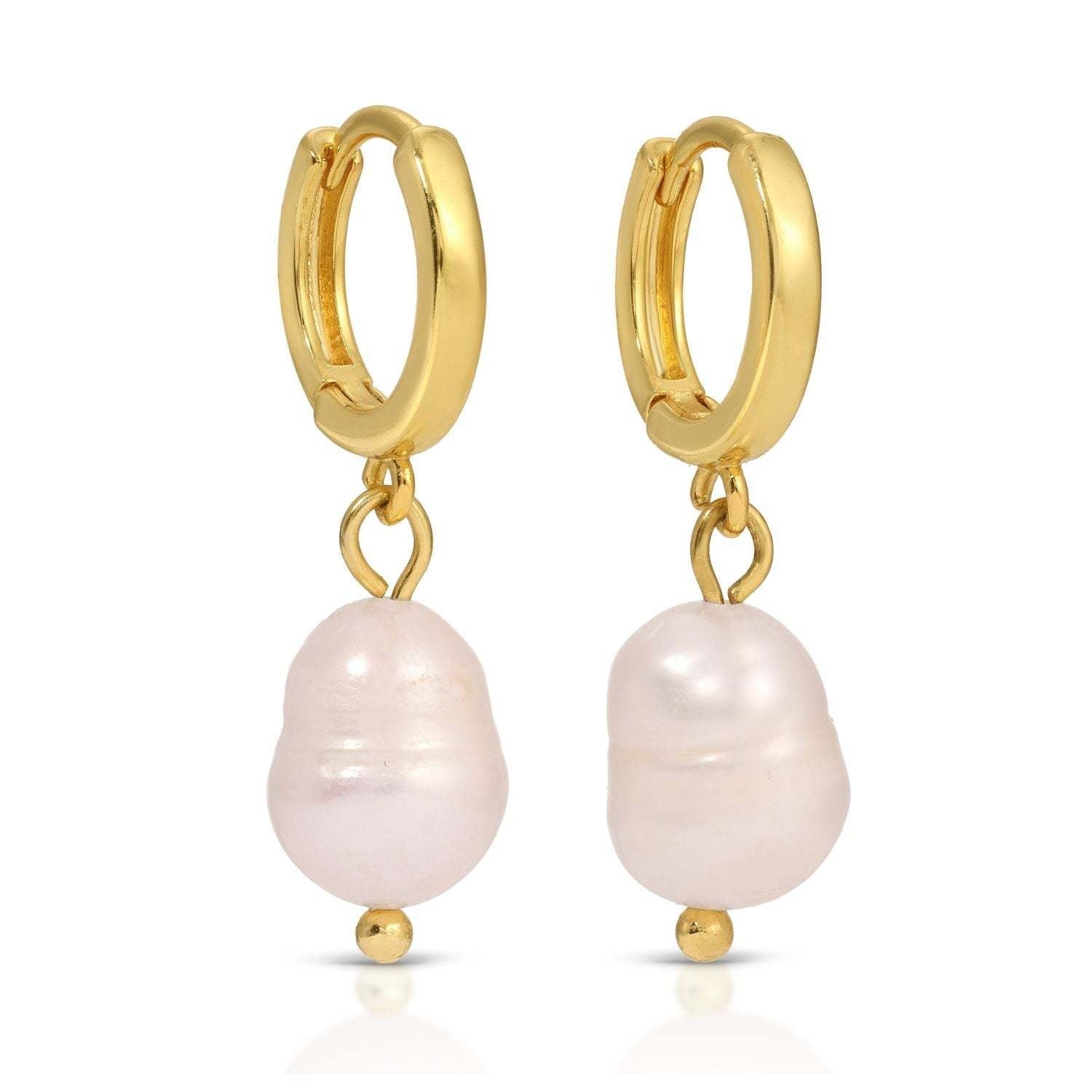 Small pearl drop huggie earrings with an 18k gold plated brass base.