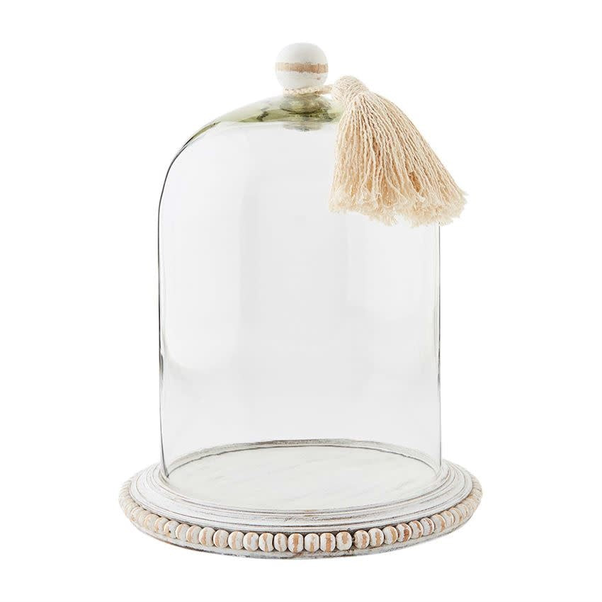 Small glass beaded cloche with mango wood handle featuring a tassel.