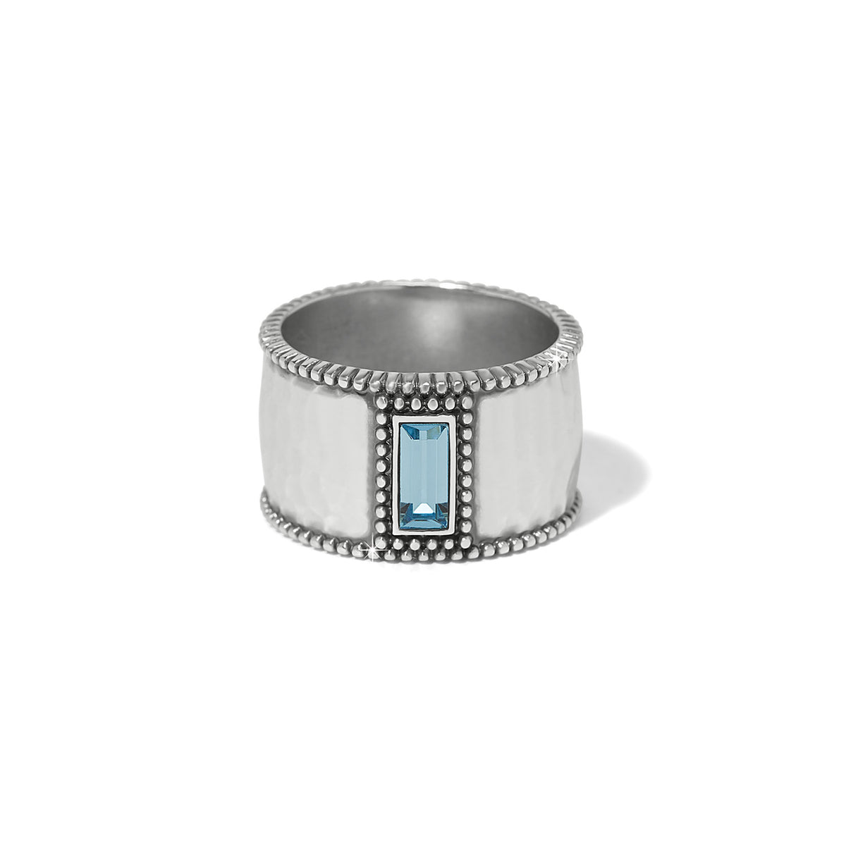 Silver-plated wide band ring featuring aquamarine crystals in a bold geometric silhouette.