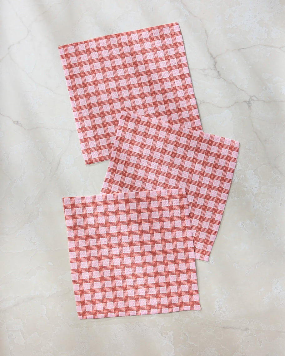 Set of three waffle weave dishcloths in recycled polyester with single-sided prints and hang loops.