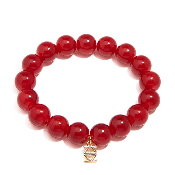 Stretch bracelet with glossy lucite glass beads in a solid color.