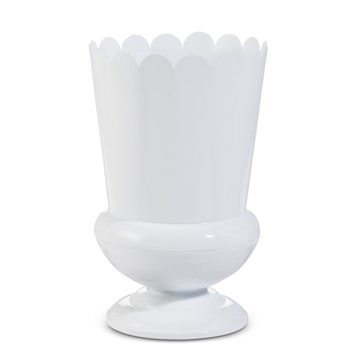 White scalloped iron urn with a pedestal base for decorative use.