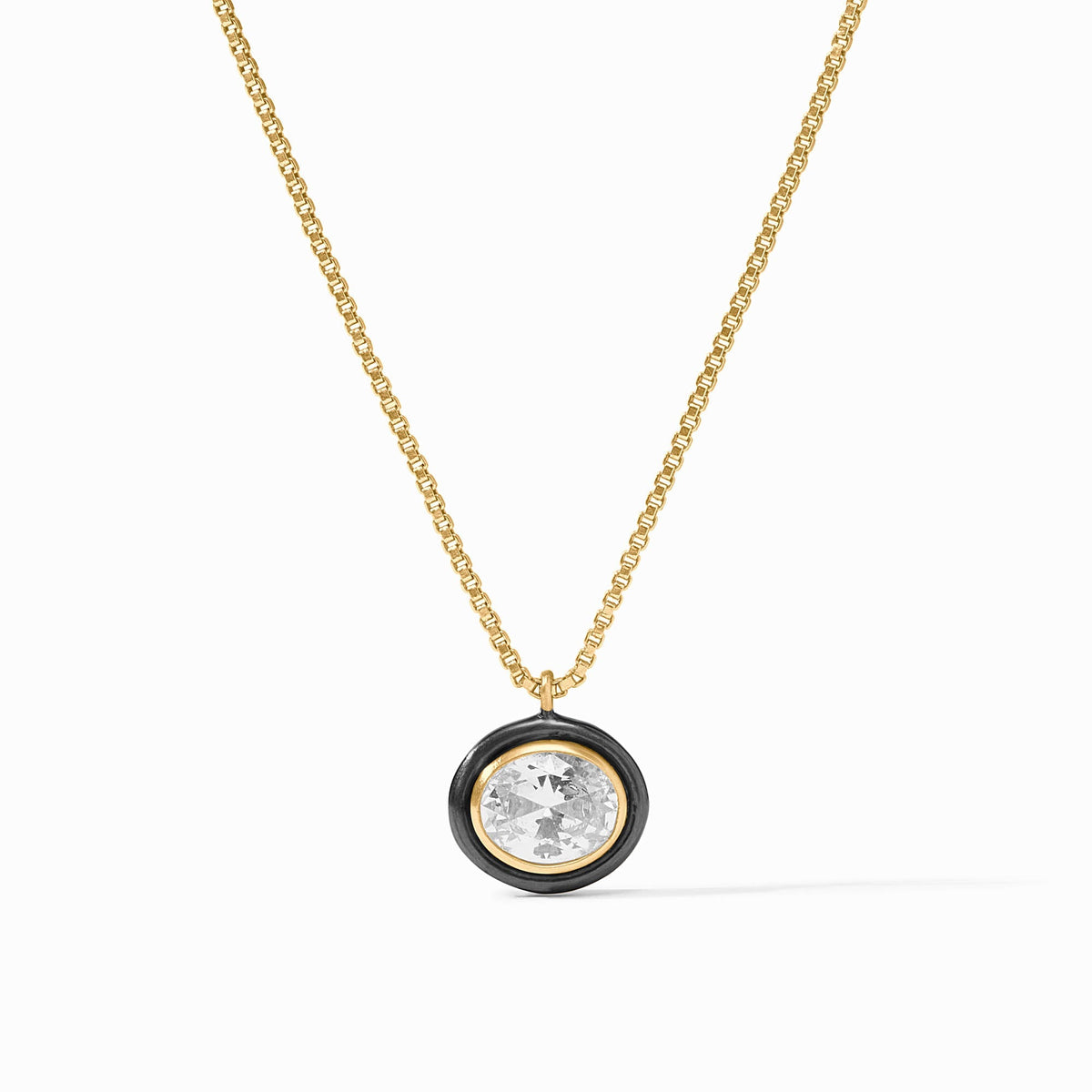 Tribeca Delicate Necklace with a round cubic zirconia pendant in a black and gold bezel setting.